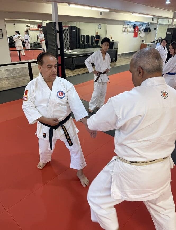 students getting taught by instructors during self defense class