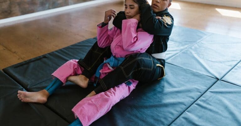 Self defense training for beginners learning escape techniques on mats